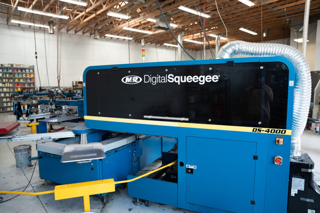 An M and R Digital Squeegee DS-4000 press on the production floor at Prodigy in Lindon, Utah