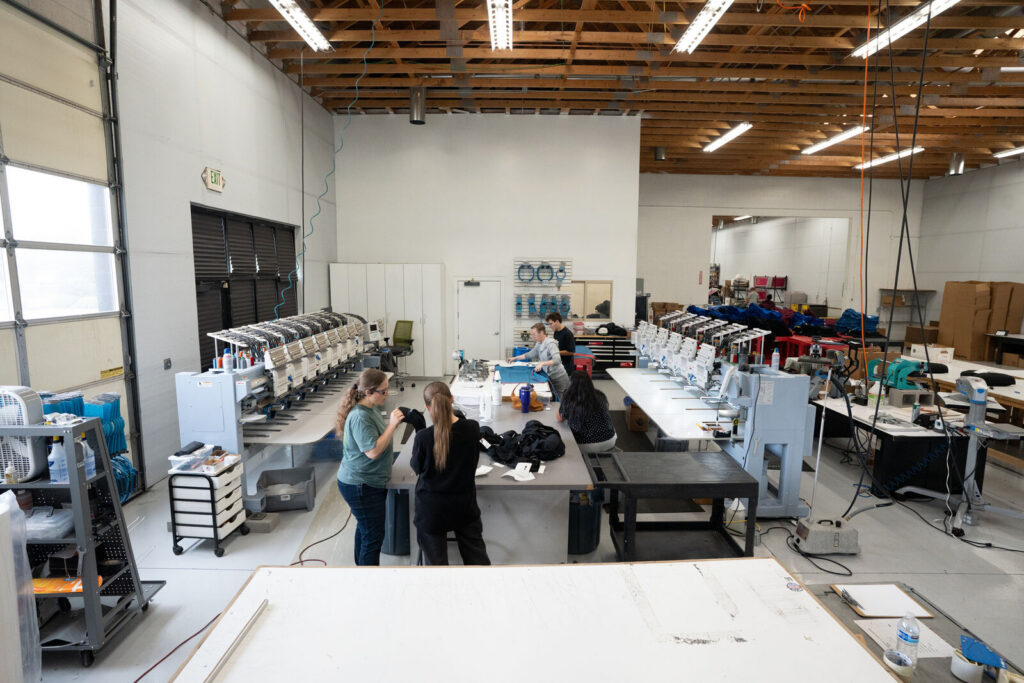 The Prodigy embroidery room in Lindon, Utah, with rows of multi-head machines running